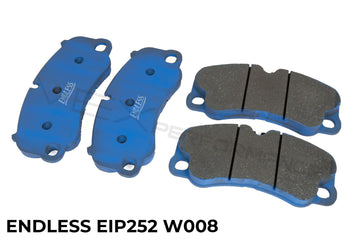 Endless performance rear brake pads for street and track use on Porsche 911 with blue backing plates.